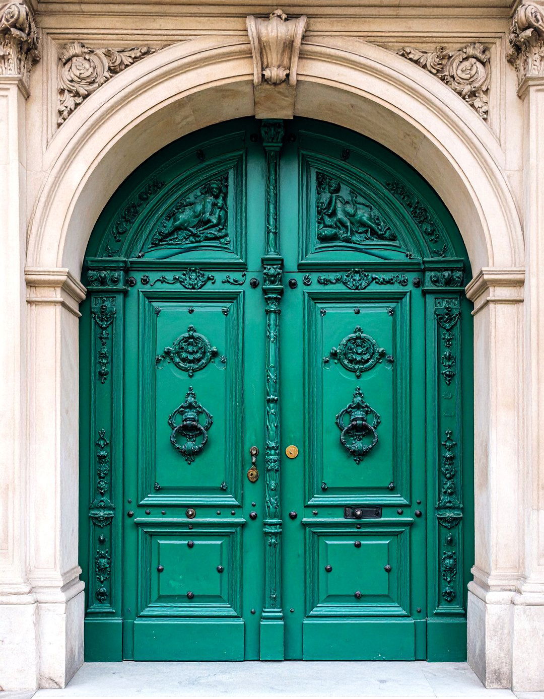 Antique Carved Door with Patina Hardware - 25 Mediterranean Front Door Ideas