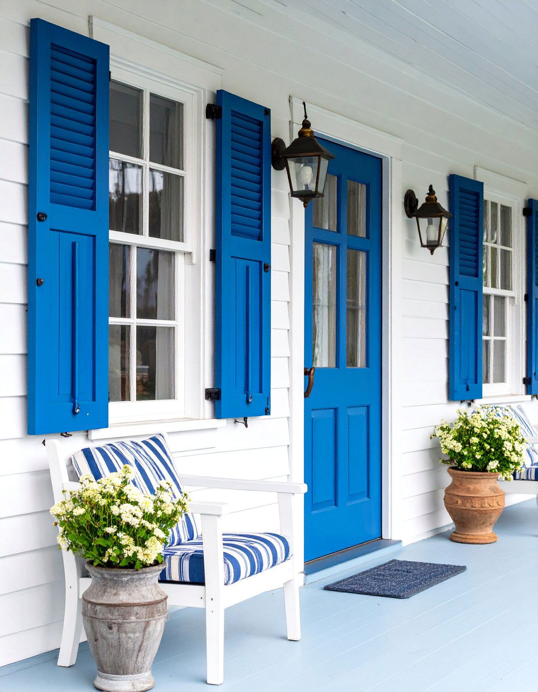 Blue and White Nautical Themed Porch with Rope Accents - 25 Small Cape Cod Front Porch Ideas