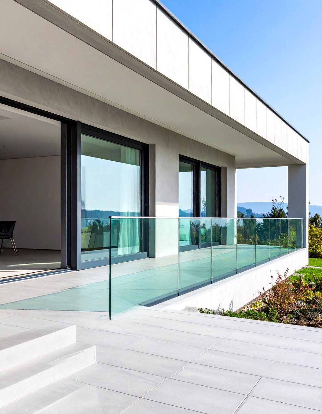 Contemporary Concrete Porch with Glass Railings - 25 Concrete Porch Ideas