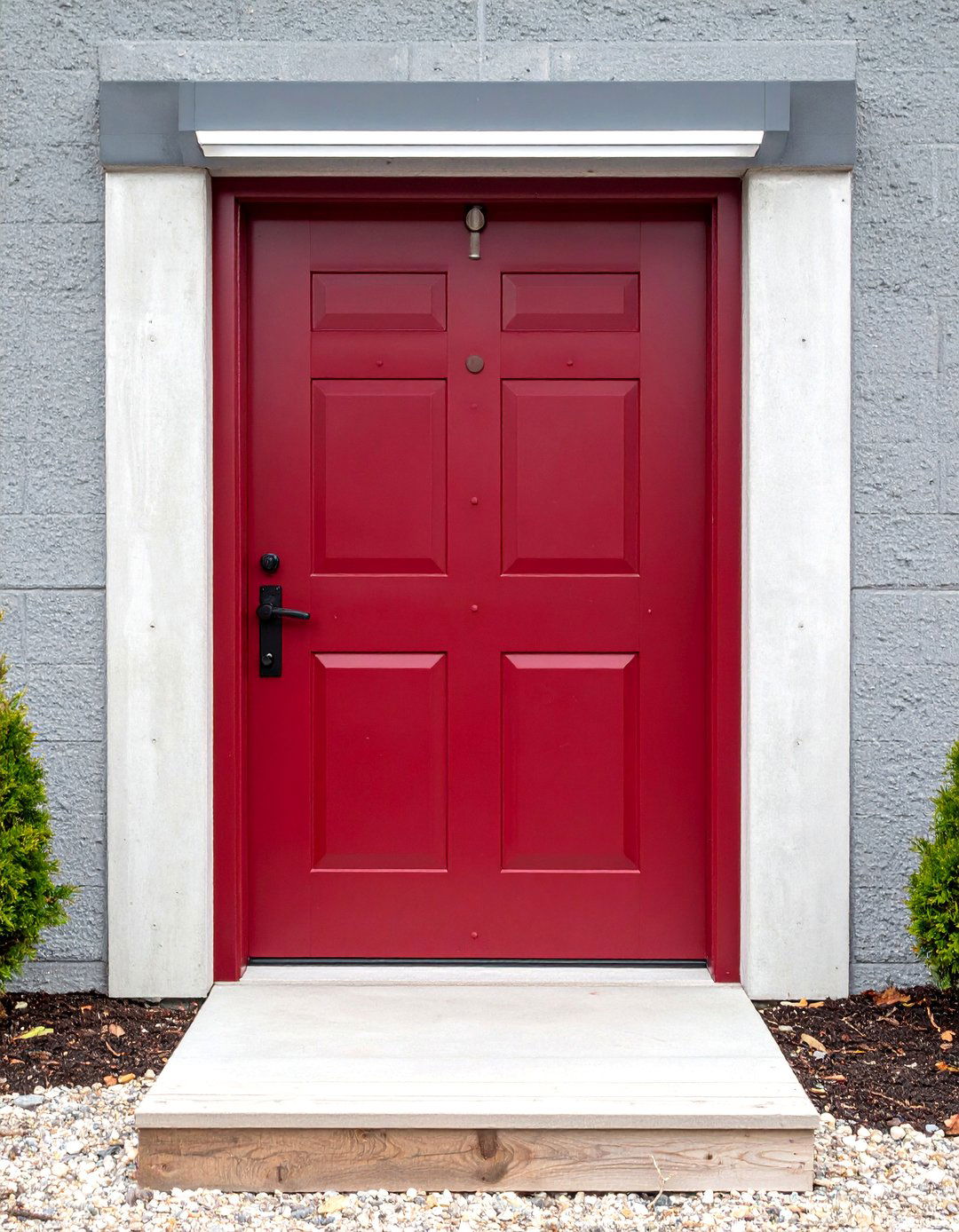 Industrial Chic Burgundy Front Door with Exposed Rivets