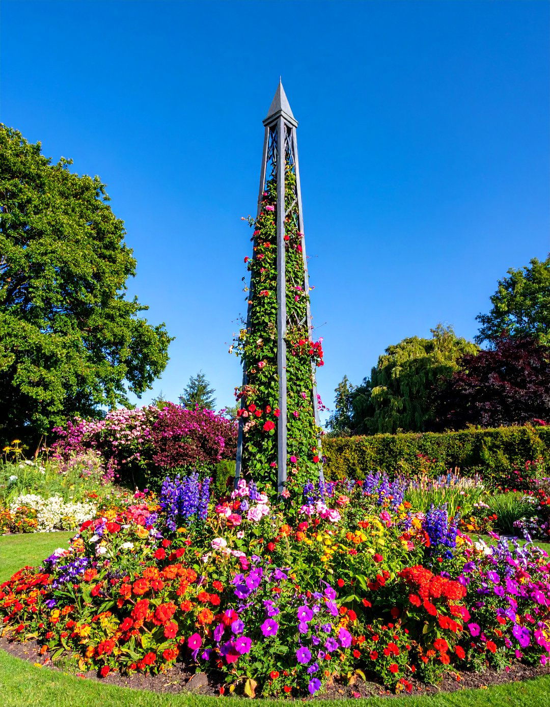 Metal Garden Obelisk with Climbing Blooms - 25 Garden Art Ideas