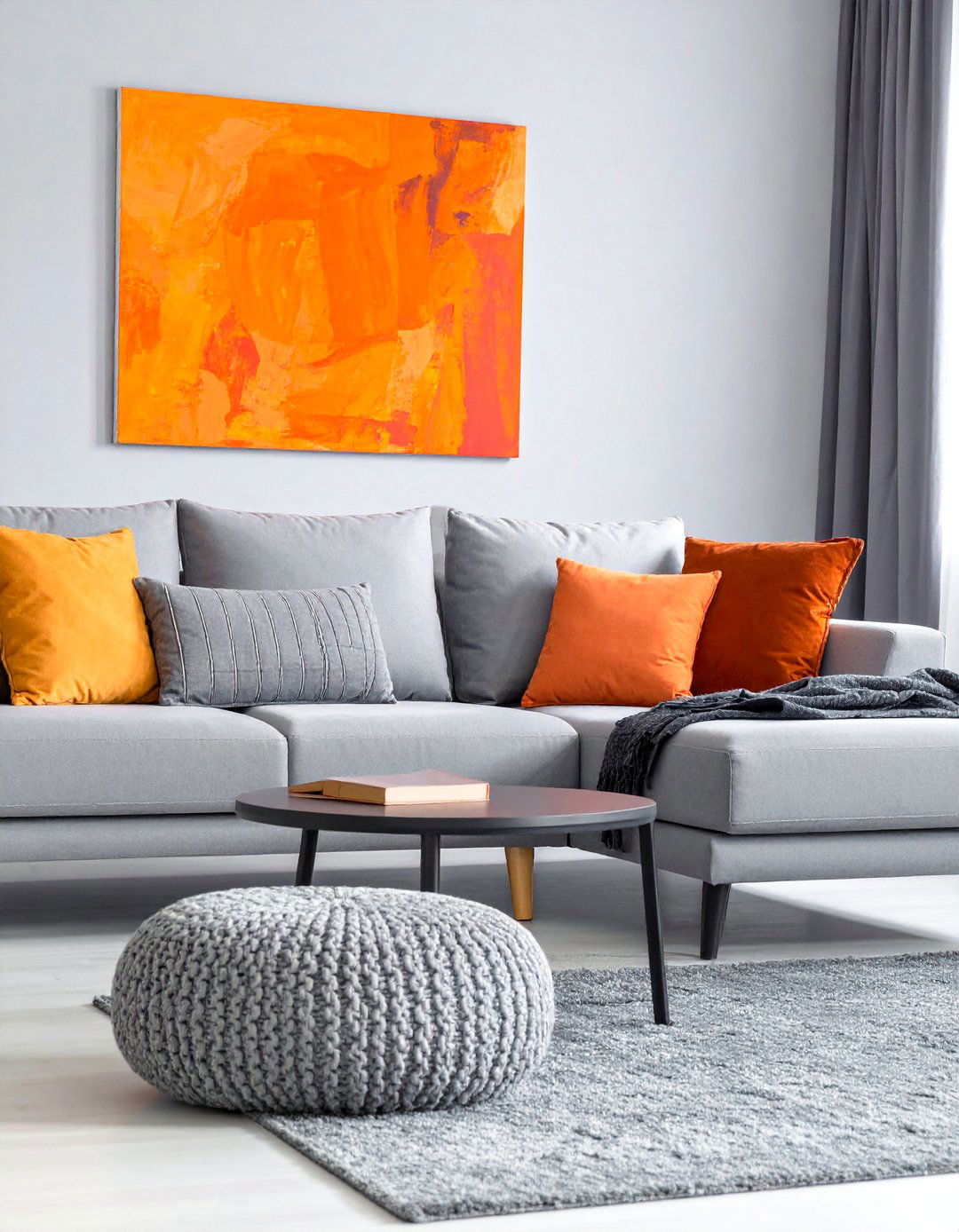 Monochromatic Grey Living Room with Vibrant Orange Artwork - 25 Orange and Grey Living Room Ideas