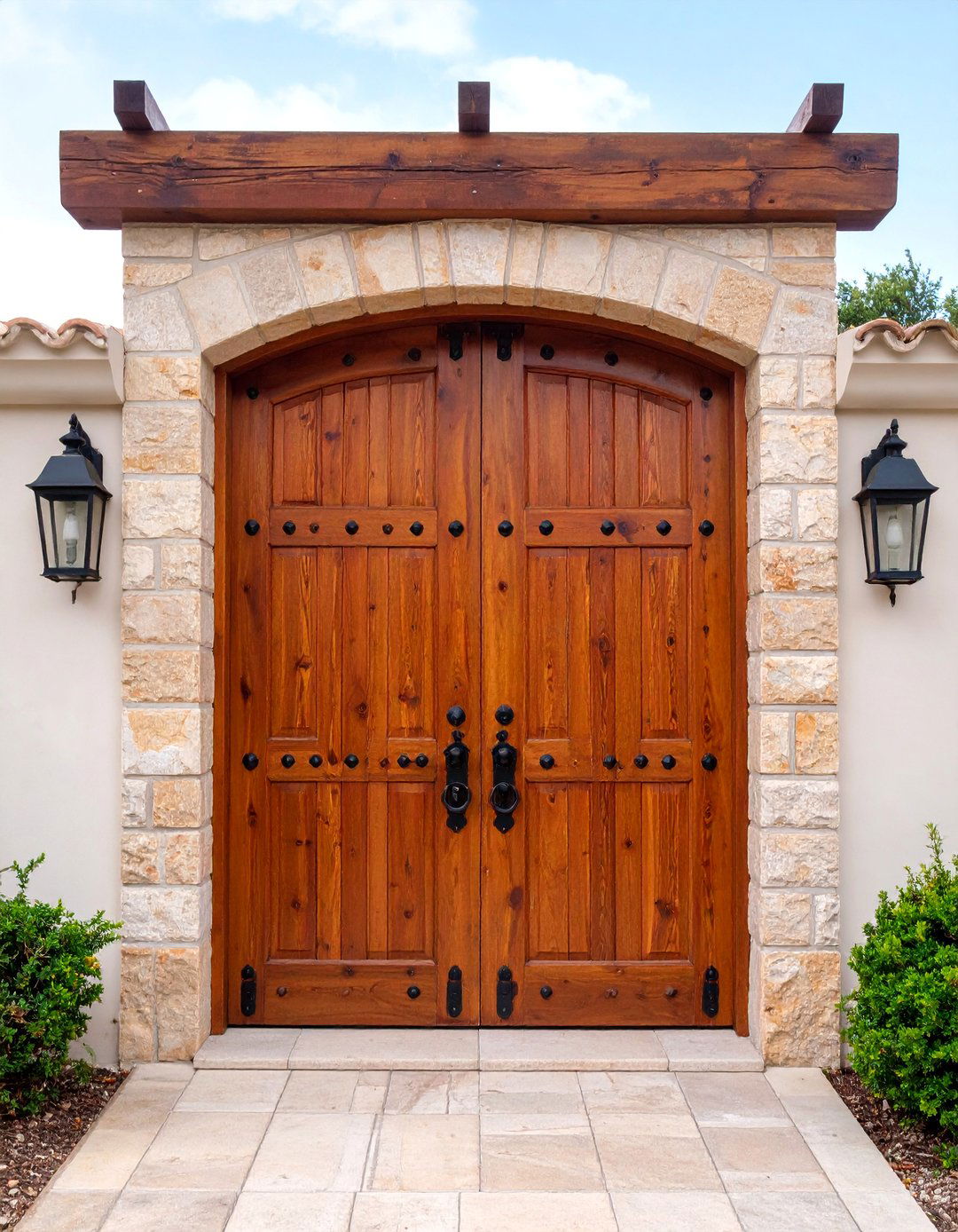 Rustic Plank Door with Iron Strap Hardware - 25 Mediterranean Front Door Ideas