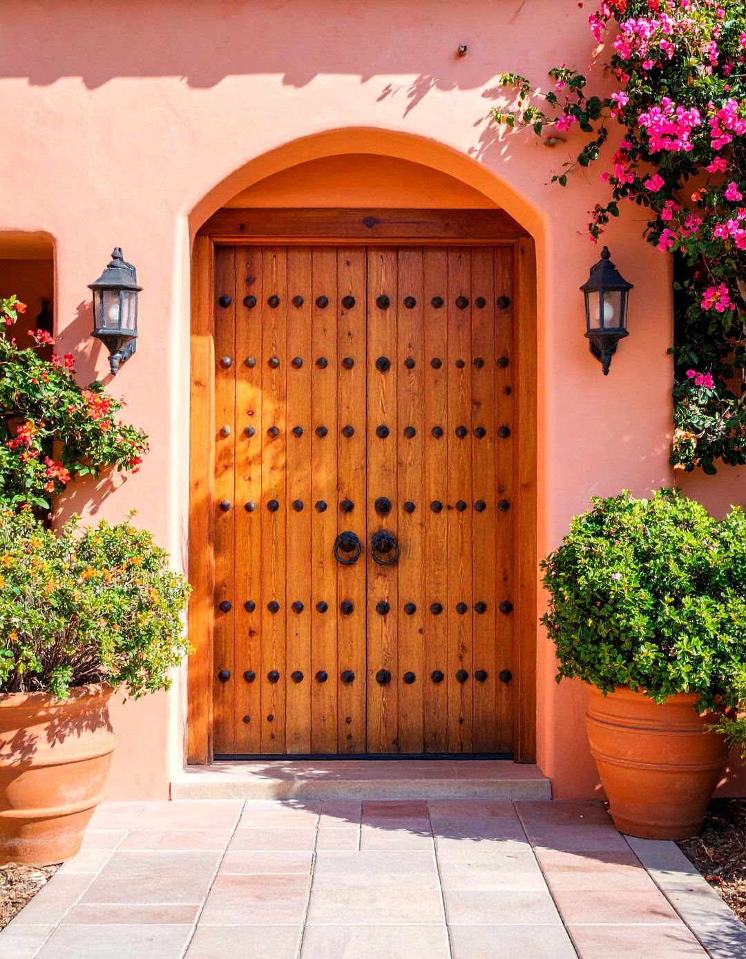 Spanish Mission Revival Thick Plank Door with Rounded Hardware - 25 Spanish Style Front Door Ideas