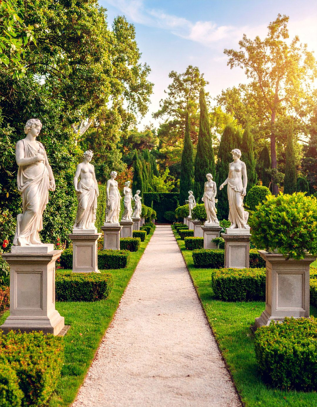 Statue Garden with Classical Sculptures and Evergreen Backdrops - 25 Italian Garden Design Ideas
