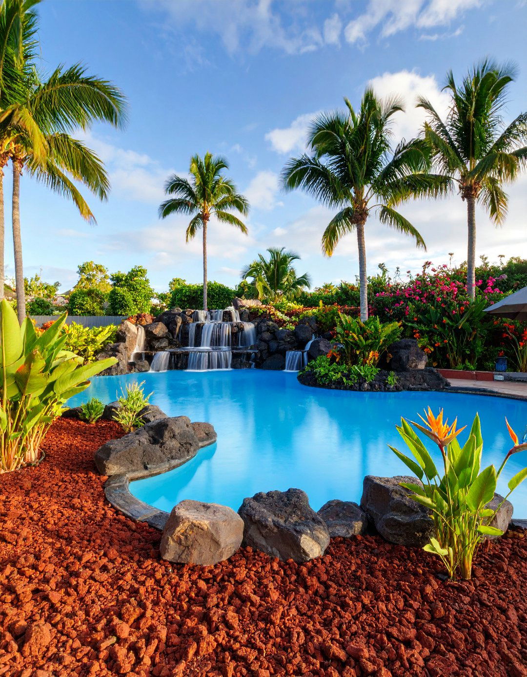 Tropical Paradise Pool Deck with Red Lava Accents - 25 Red Lava Rock Landscaping Ideas